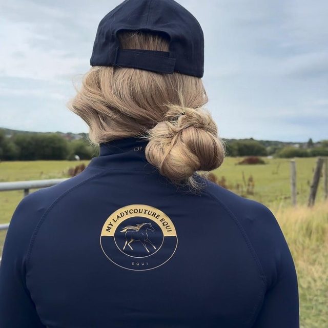 Back of the navy My Lady base layer showing the gold crest logo